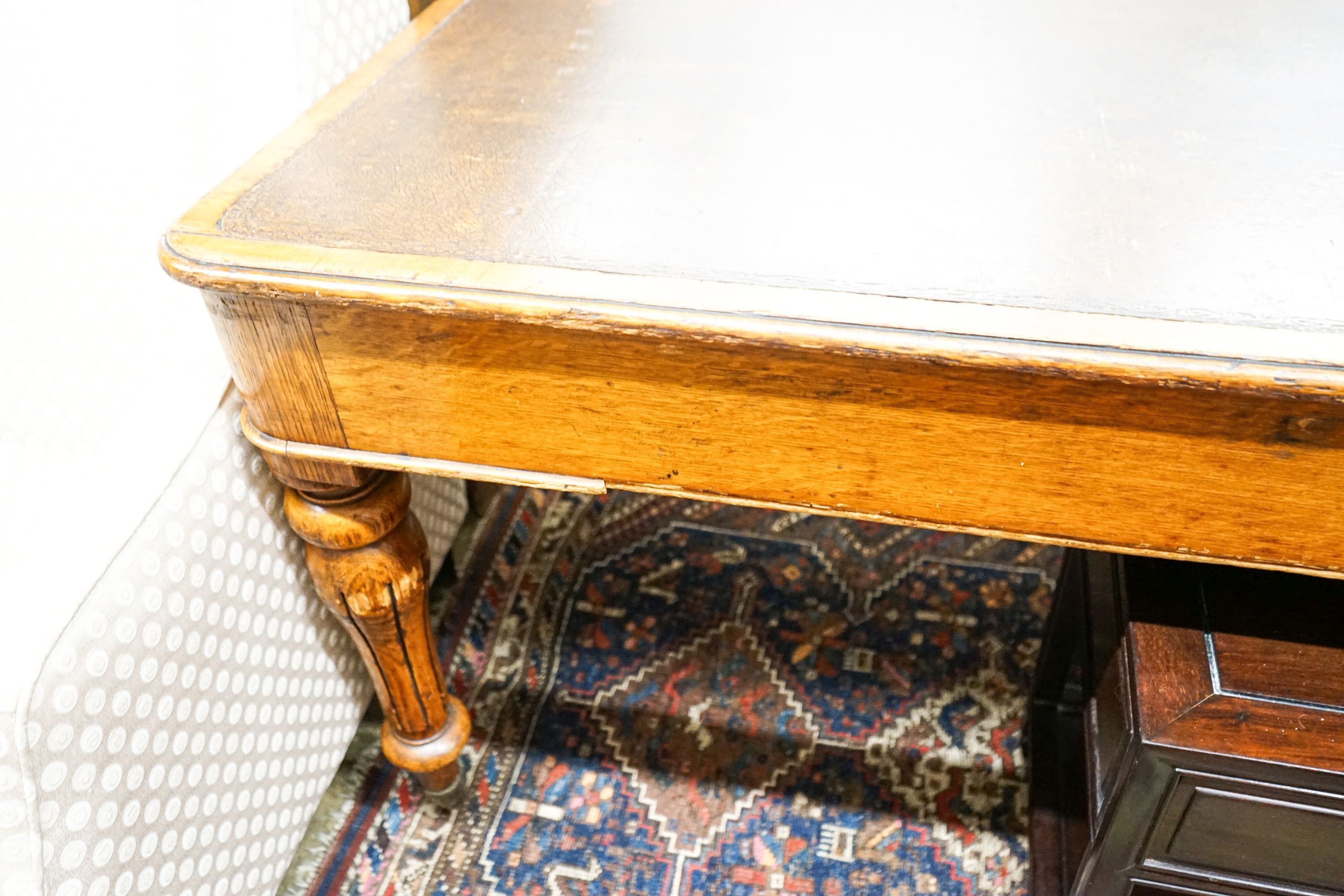 An early Victorian oak library table fitted two end drawers, from the Library of The Royal College of Surgeons, London, width 196cm, depth 105cm, height 76cm